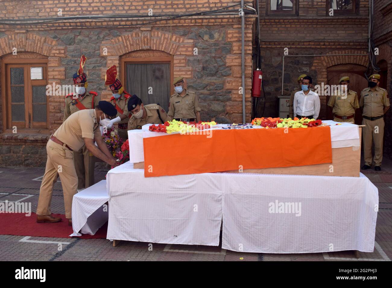 Sopore, Kashmir. June 12th 2021. Wreath laying ceremony of two policemen who were killed. At least two security personnel and two civilians were killed in a militant attack in north Kashmir's Sopore. At least three others, including a policeman were injured in the attack. They fired at a joint party of the Central Reserve Police Force (CRPF) and police near Main Chowk Sopore in Baramulla district of Jammu and Kashmir. Stock Photo