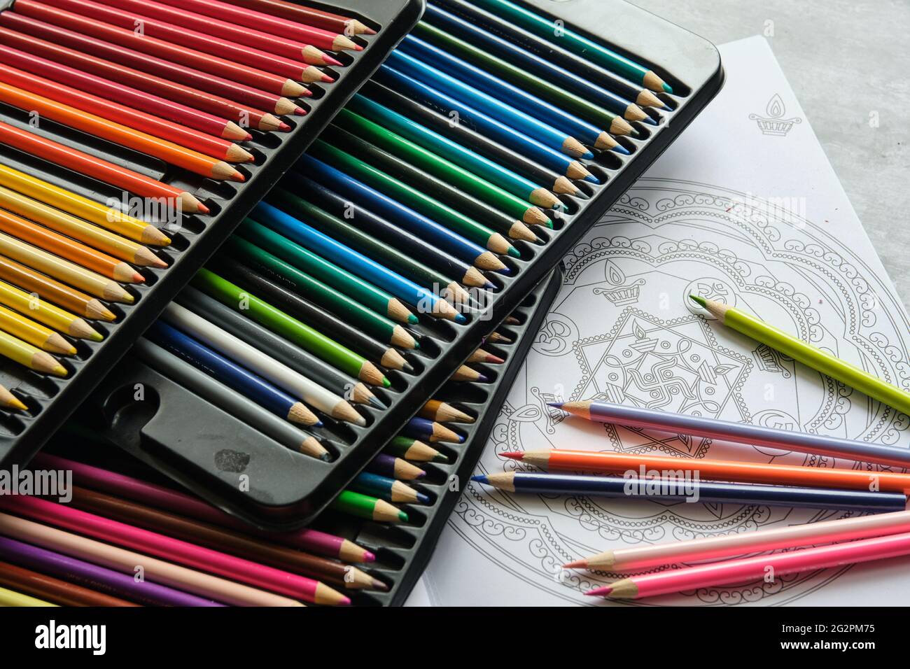bright colored pencils on a gray background Stock Photo