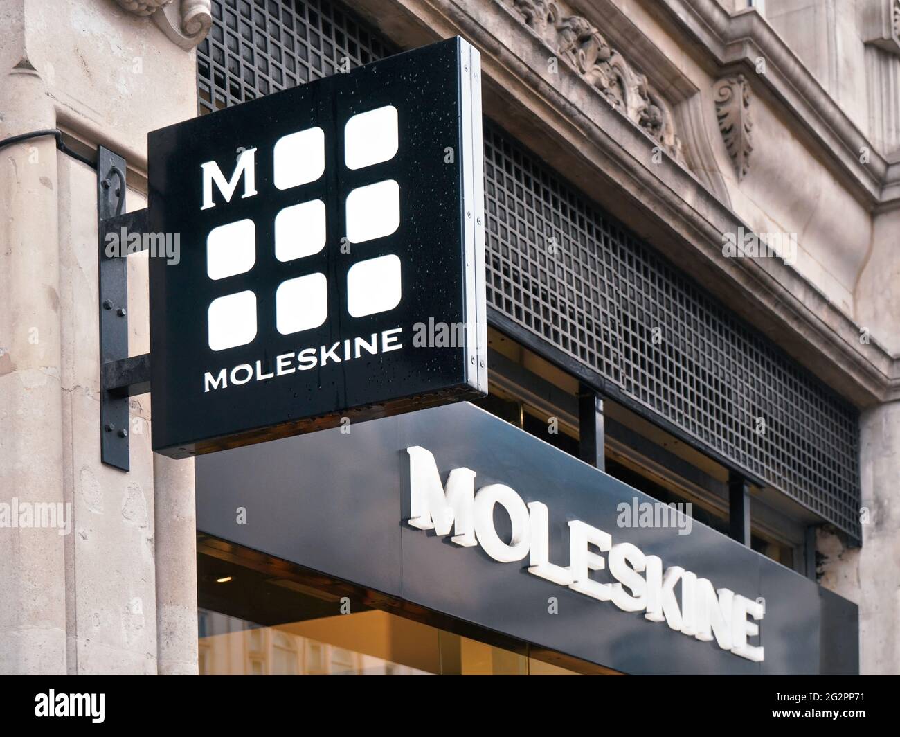 London, United Kingdom - February 01, 2019: Black and white Moleskine logo on their shop at Oxford Street. It is Italian paper and stationery manufact Stock Photo
