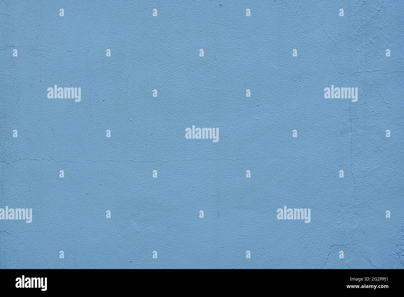 Fine plaster wall with blue paint some cracks - abstract background texture Stock Photo