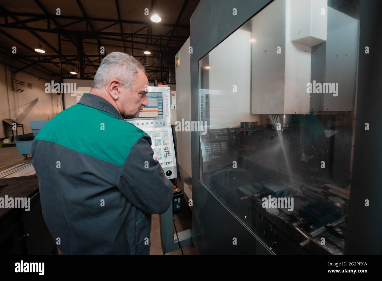 A smart factory worker or engineer makes machines in a production