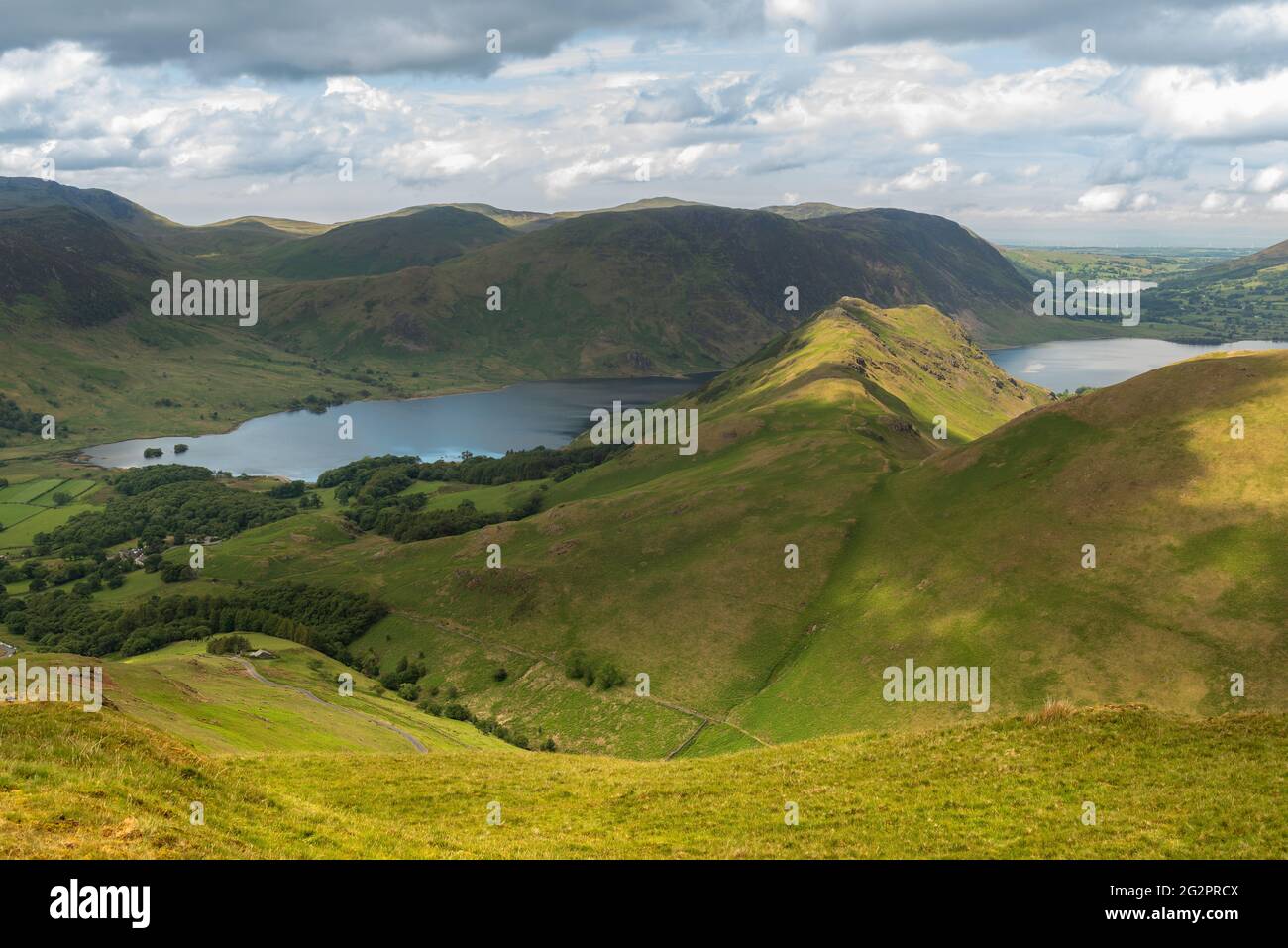 Beautiful view of Crummock Water and Cumbrian fells on a sunny afternoon in the Lake District National Park. Stock Photo