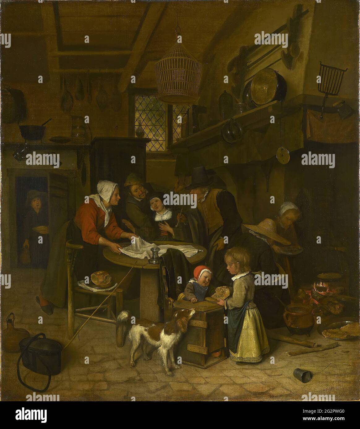 Jan Steen a Scene in a Peasant Kitchen with a Servant Laying the
