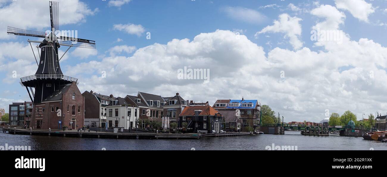 Haarlem, Netherlands - 21 May, 2021: panorama view of the Dee Adrian Windmill and Binnen Spaarne River in Haarlem Stock Photo