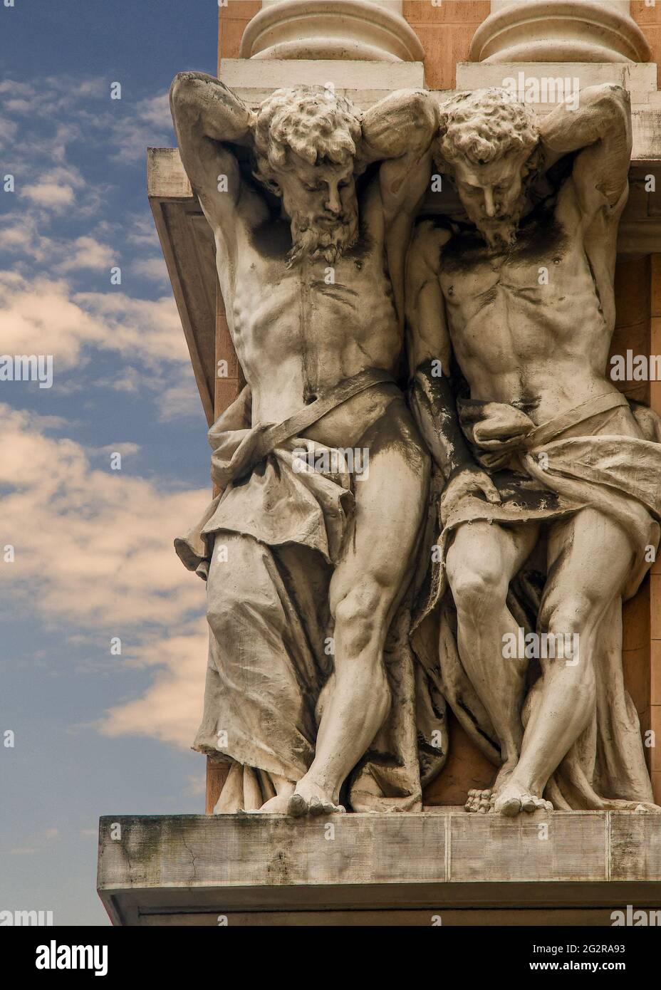 Close-up of a pair of huge telamons on the façade of Palazzo dei Giganti (Giant's Palace) in the centre of Genoa, Liguria, Italy Stock Photo