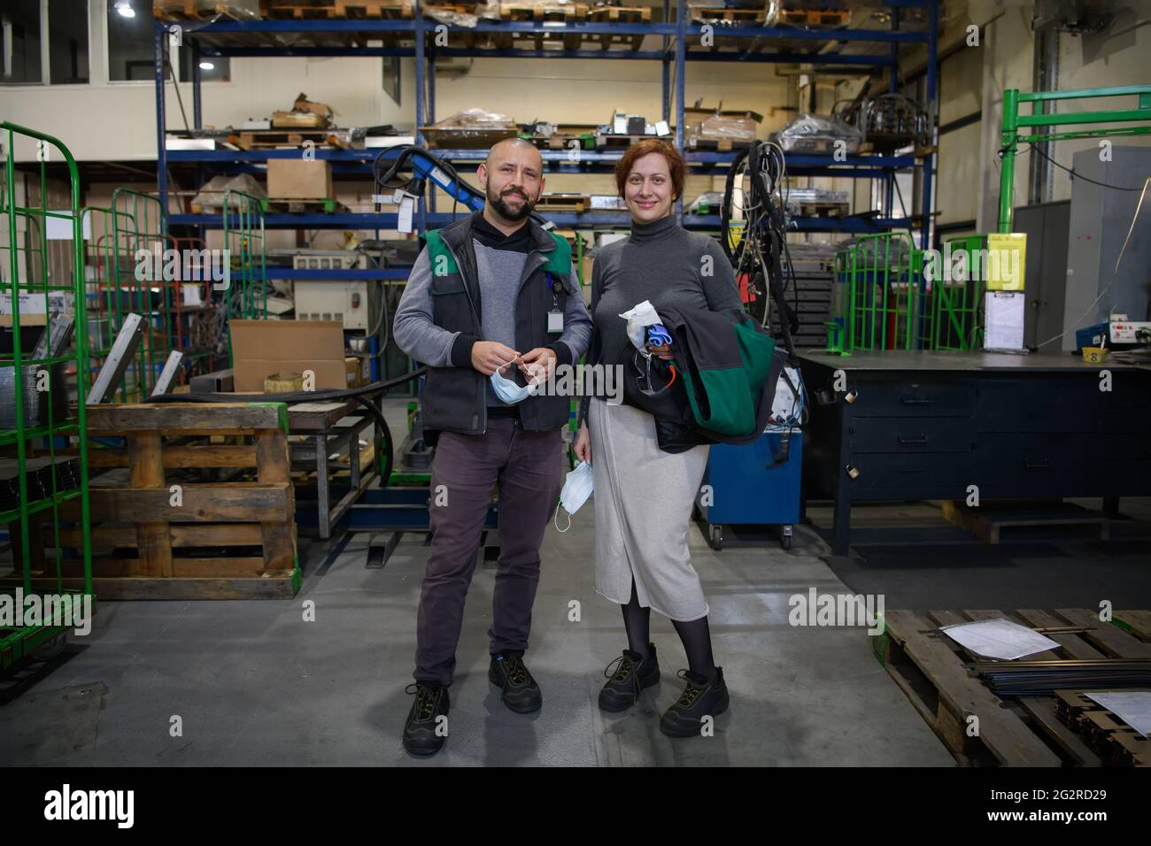 Industrial workers with face masks protected against corona virus ...