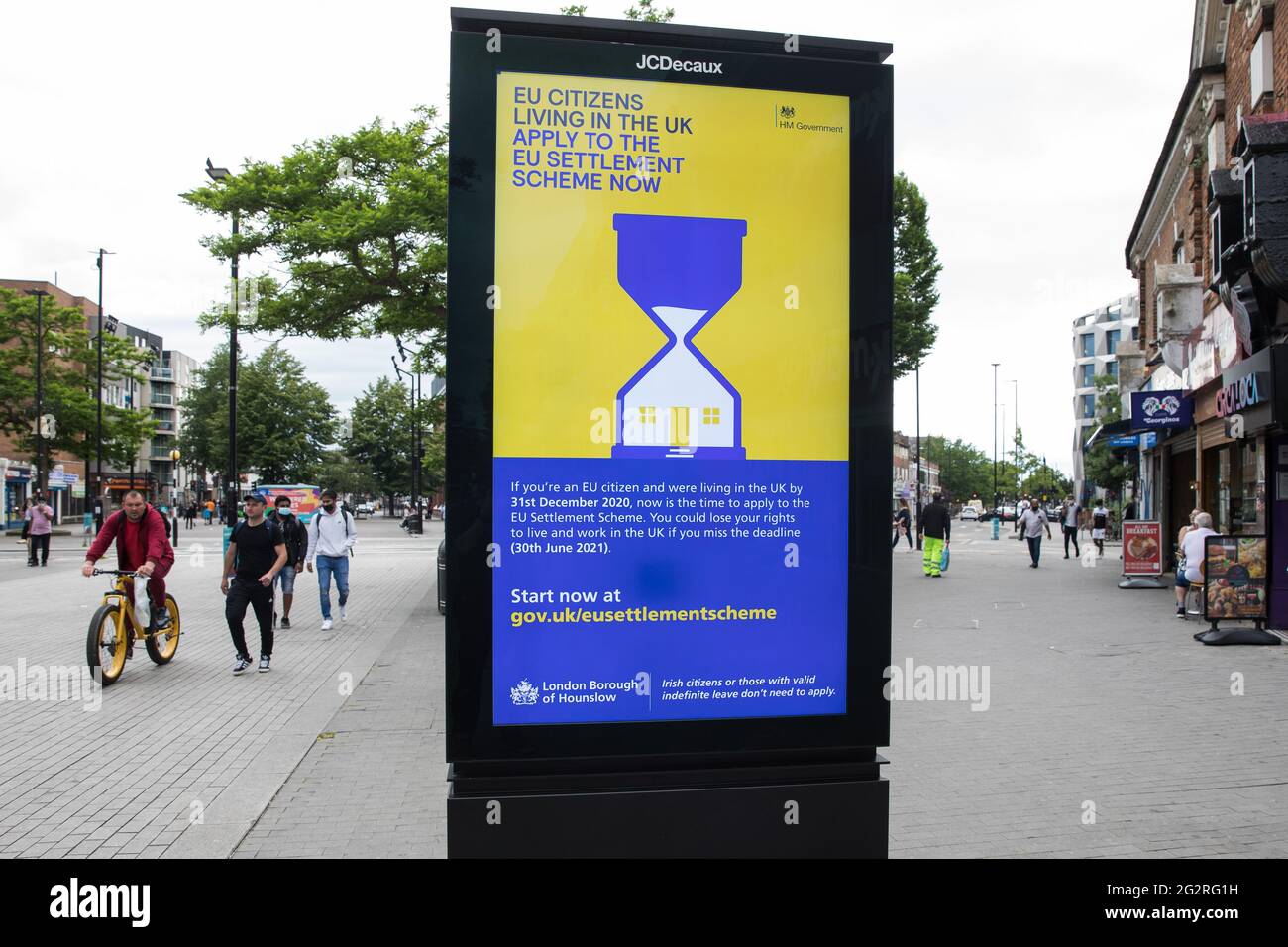 Hounslow, UK. 11th June, 2022. An advertisement for the EU Settlement Scheme appears on a display screen in the High Street. The UK government is using such advertisements to urge EU citizens living in the UK by 31st December 2020 to apply to the EU Settlement Scheme by 30th June 2021. Credit: Mark Kerrison/Alamy Live News Stock Photo