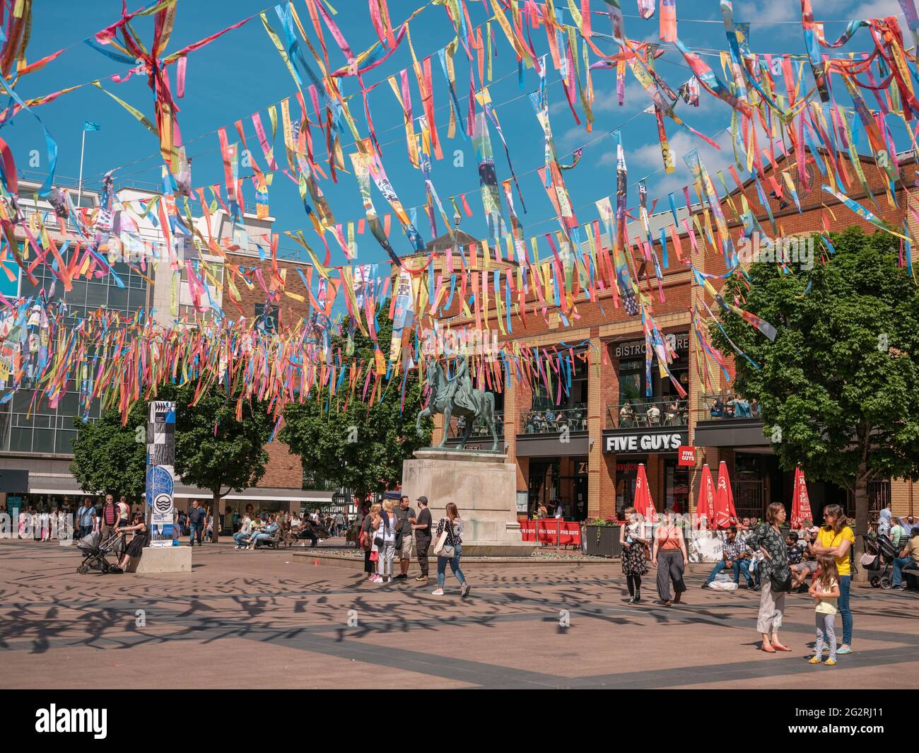 Broadgate, Coventry. Broadgate square is decorated with flags and banners to launch City of Culture 2021. The banners were designed by local schools. Stock Photo