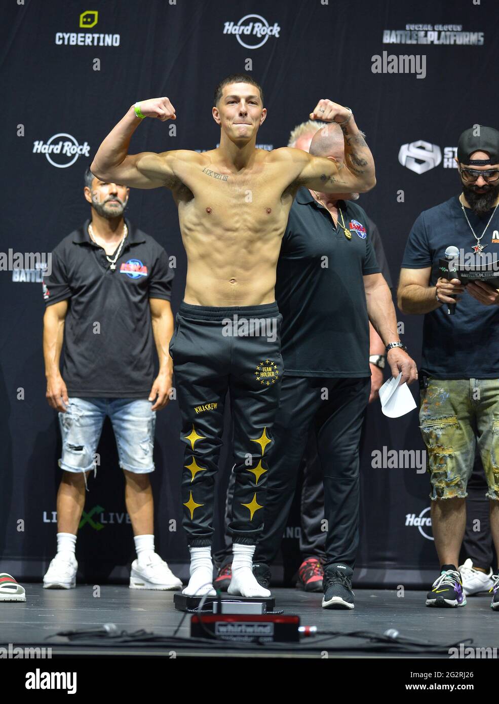 Hollywood, Florida, USA. 11th June, 2021. TikTok personality Bryce Hall (L) poses on scale during the LiveXLive's Social Gloves: Battle Of The Platforms Pre-Fight Weigh-In at Hard Rock Live! in the Seminole Hard Rock Hotel & Casino on June 11, 2021 in Hollywood, Florida. Credit: Mpi10/Media Punch/Alamy Live News Stock Photo