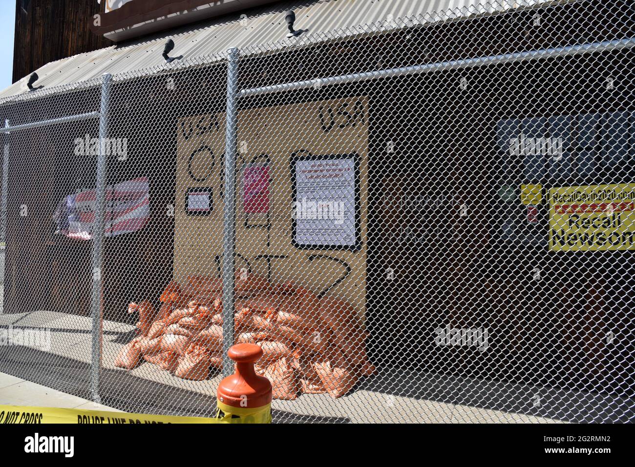 Burbank, CA USA - Aprl 9, 2021: Tinhorn Flats entrance boarded, sandbagged and fenced in by city to penalize it for having opened during the December Stock Photo