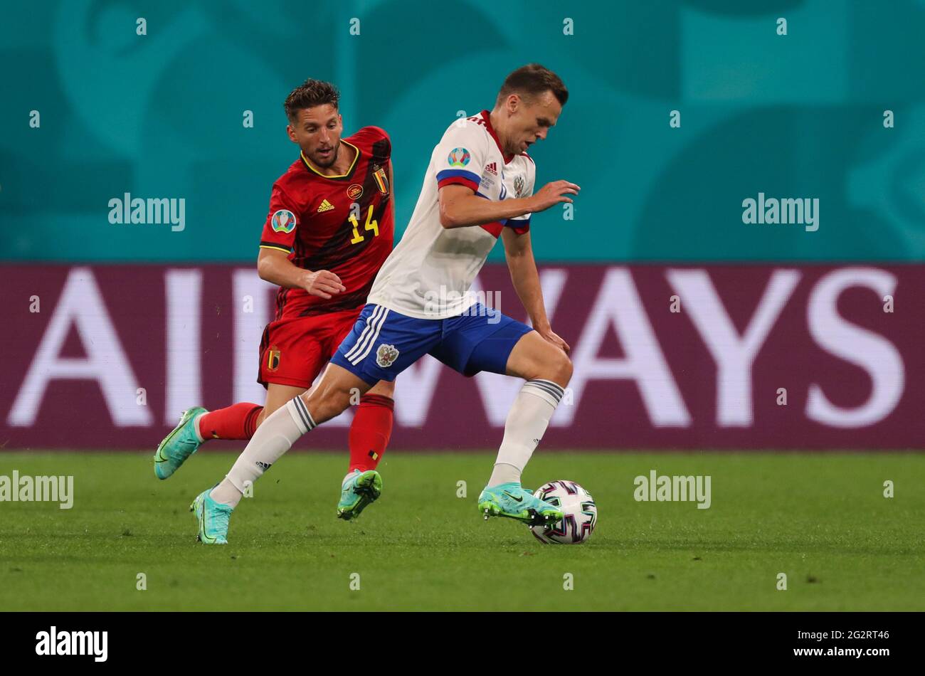 12 June 2021, Russia, St. Petersburg: Football: European Championship, Belgium - Russia, preliminary round, Group B, Matchday 1 at St. Petersburg Stadium. Denis Cheryshev (Russia) and Dries Mertens (Belgium, l) in action. Important: For editorial news reporting purposes only. Not used for commercial or marketing purposes without prior written approval of UEFA. Images must appear as still images and must not emulate match action video footage. Photographs published in online publications (whether via the Internet or otherwise) shall have an interval of at least 20 seconds between the posting. P Stock Photo