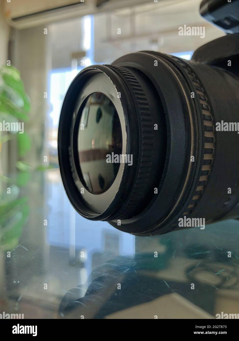 closeup of digital camera lens side view,blurred background,photography equipment.professional dslr object Stock Photo