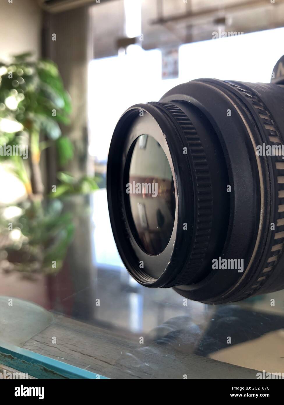 closeup of digital camera lens side view,blurred background,photography equipment.professional dslr object Stock Photo