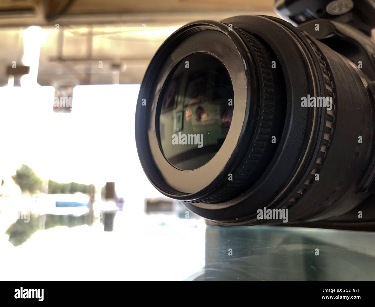 closeup of digital camera lens side view,blurred background,photography