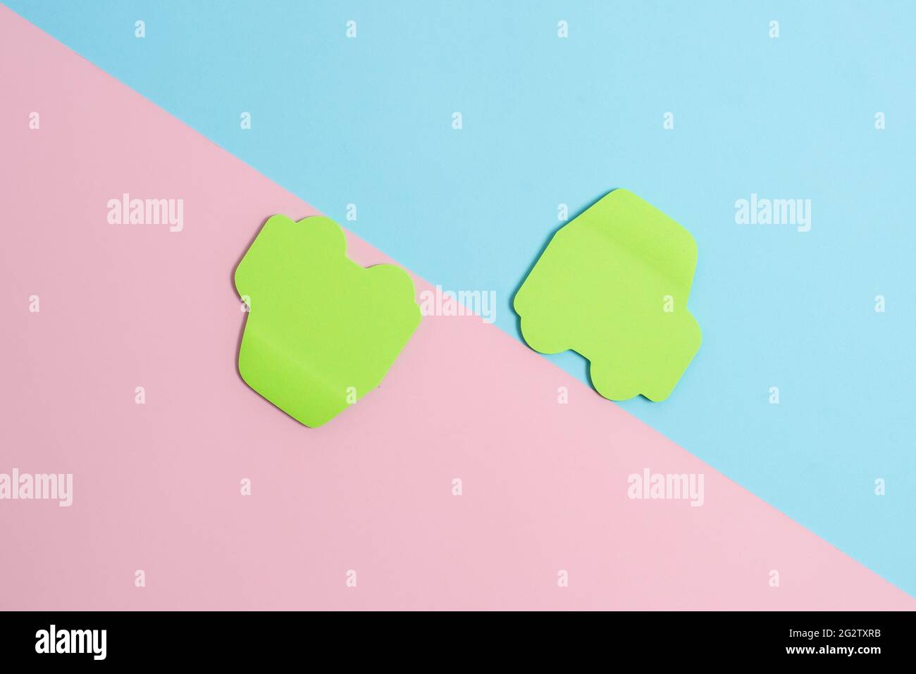 Two Objects Arranged Facing Inward Outward On a Separated Coloured ...