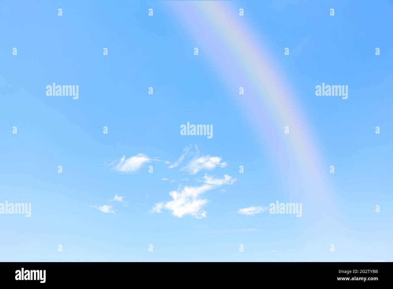 Rainbow on the clear sky . Sunny sky after rain Stock Photo - Alamy