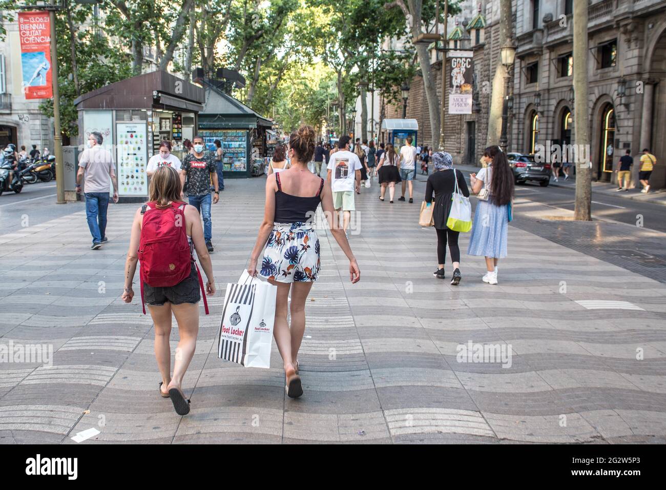 A woman seen with a bag from the shoe store, Foot Locker, in the Ramblas of  Barcelona.With the arrival of summer and the opening to tourists in Spain,  the beaches and the