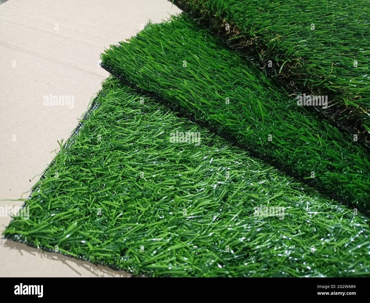 Artificial grass pieces. Samples of flooring. Artificial grass closeup