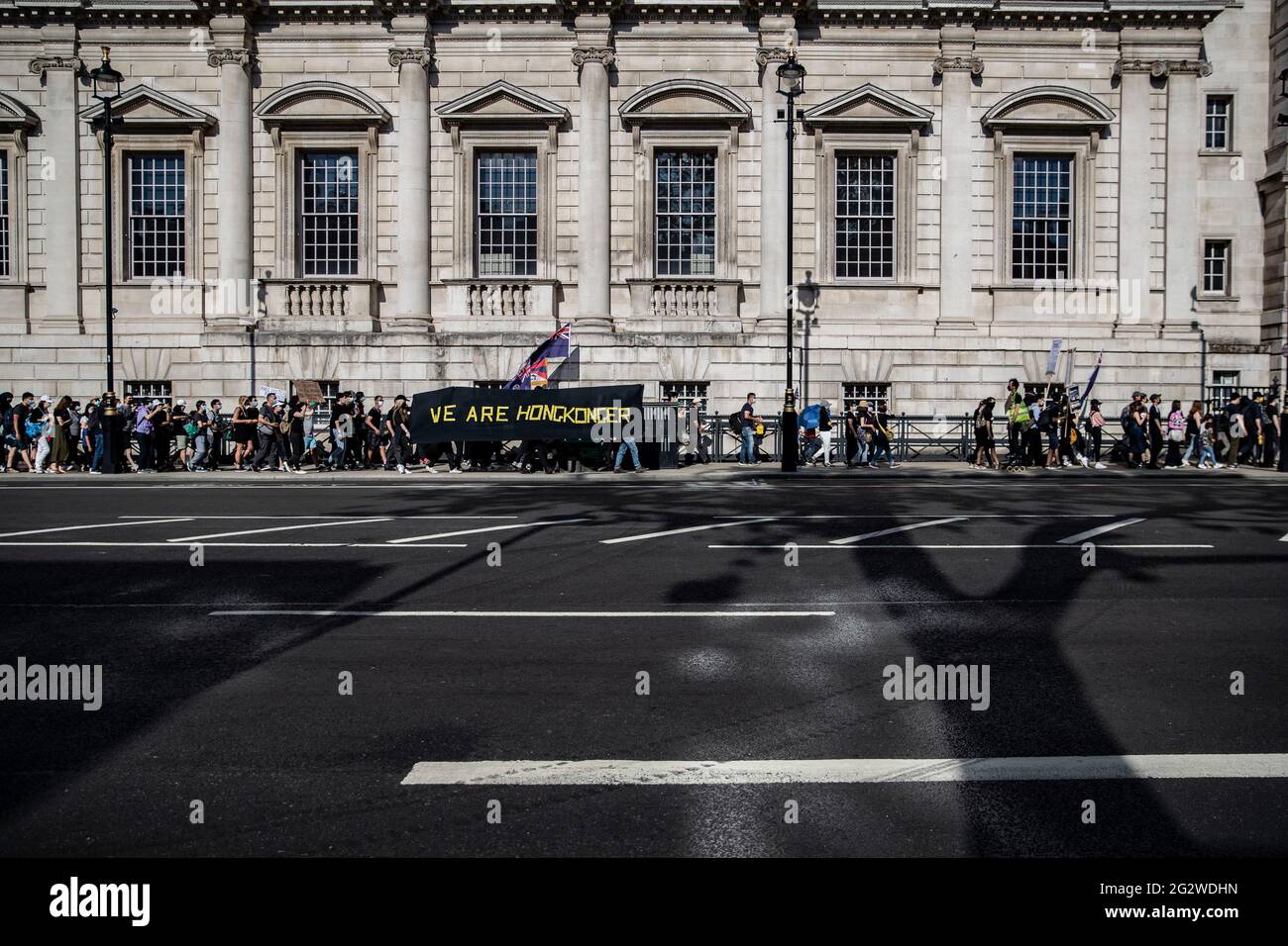 London, UK. 12th June, 2021. Pro-democracy activists hold banner that reads 'We 'are Hongkonger during a rally in London, UK on June 12, 2021 to mark the second anniversary of the start of massive pro-democracy protests which roiled Hong Kong in 2019 Credit: May James/ZUMA Wire/Alamy Live News Stock Photo