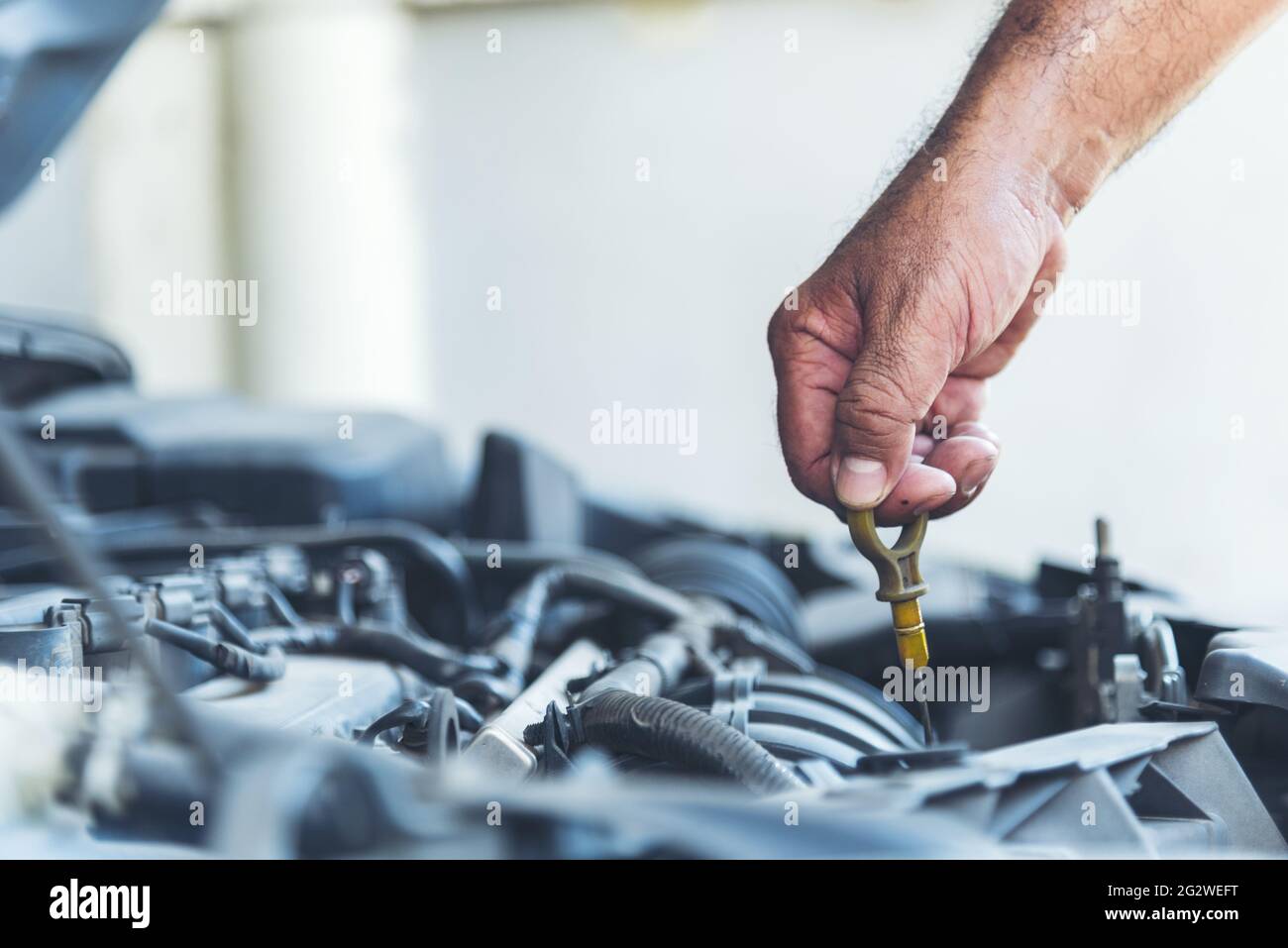 Mechanic Car Service in automobile garage auto car and vehicles service mechanical engineering. Automobile mechanic hands car repairs automotive techn Stock Photo