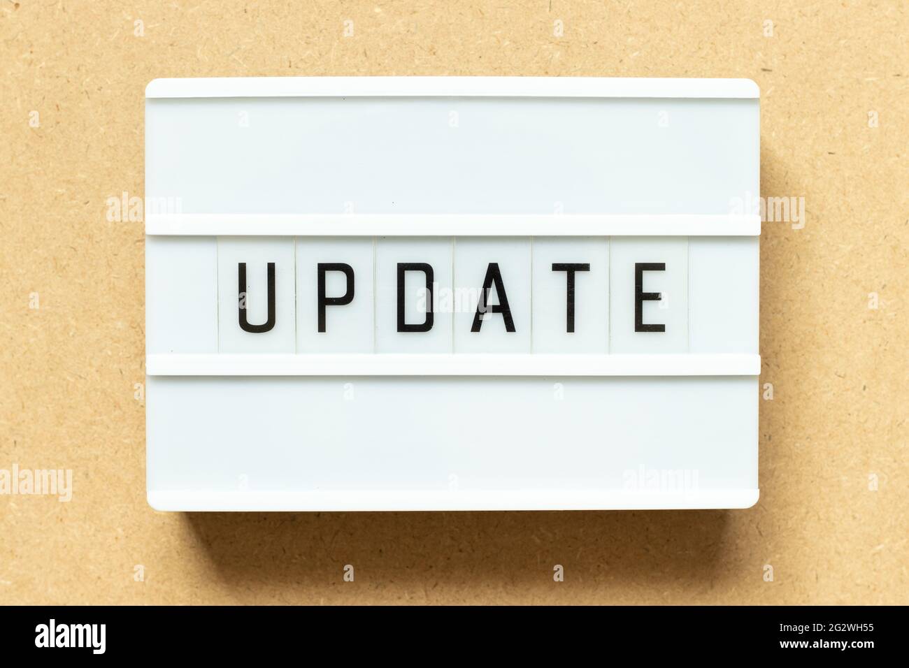 Lightbox with word update on wood background Stock Photo
