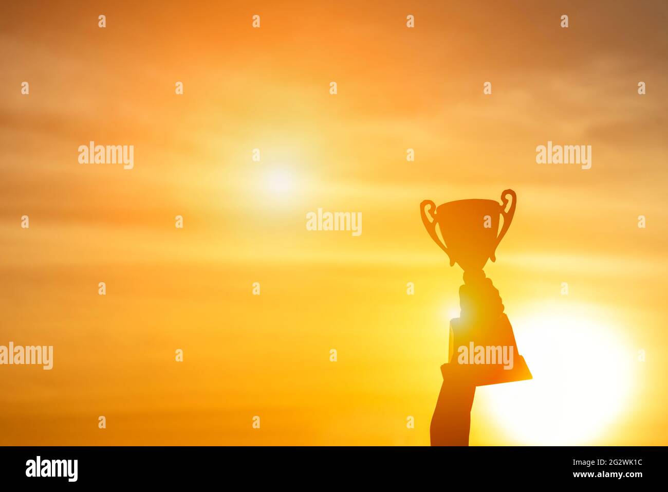 Winner win trophy prize champion concept. Best sport team win championship competition award cup for professional champion challenge. Silhouette hands Stock Photo