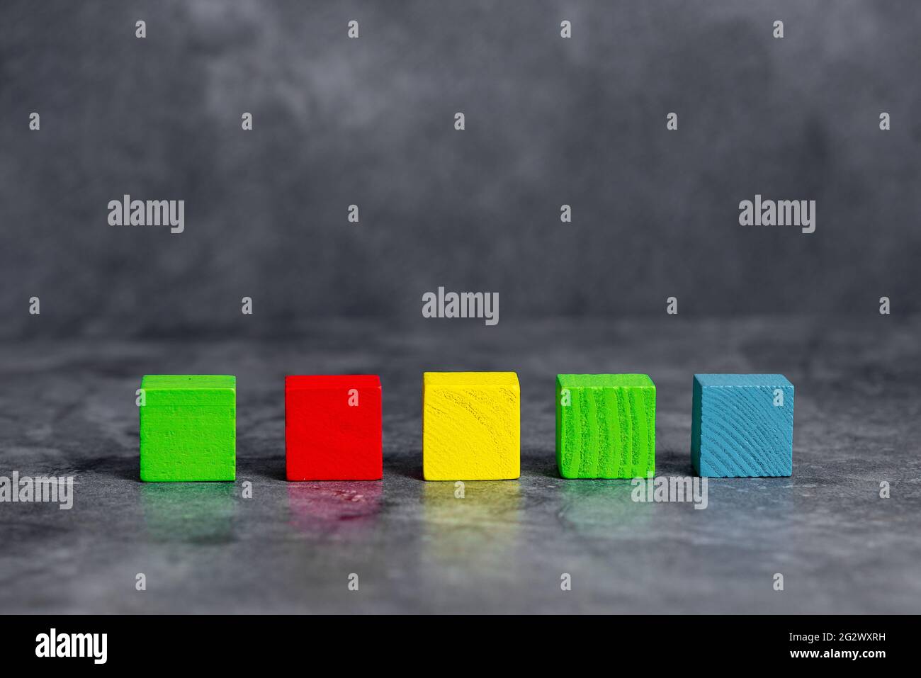 Stack of Sample Cube Rectangular Boxes On Surface Polished With Multi-Colour Stock Photo