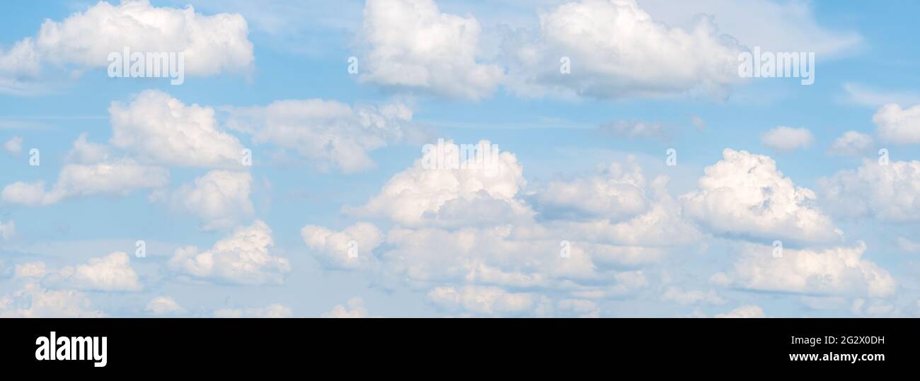 Panoramic picture with Fluffy White Clouds on a blue sky Stock Photo ...