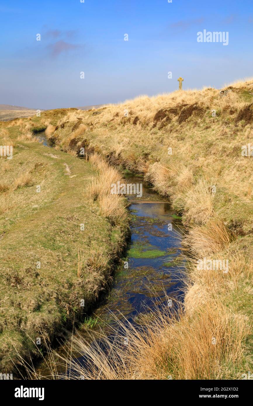 The Devonport Leat in the Dartmoor National Park with Hutchinson's Cross in the distance. Stock Photo