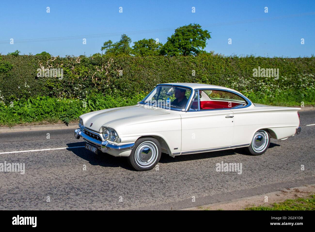 1963 60s white Ford Capri Gt 1498cc petrol 2dr two-door coupé, en-route to Capesthorne Hall classic May car show, Cheshire, UK Stock Photo