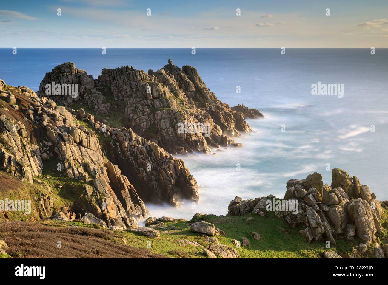 Logan Rock on the headland of Terryn Dinas near Porthcurno in Cornwall. Stock Photo