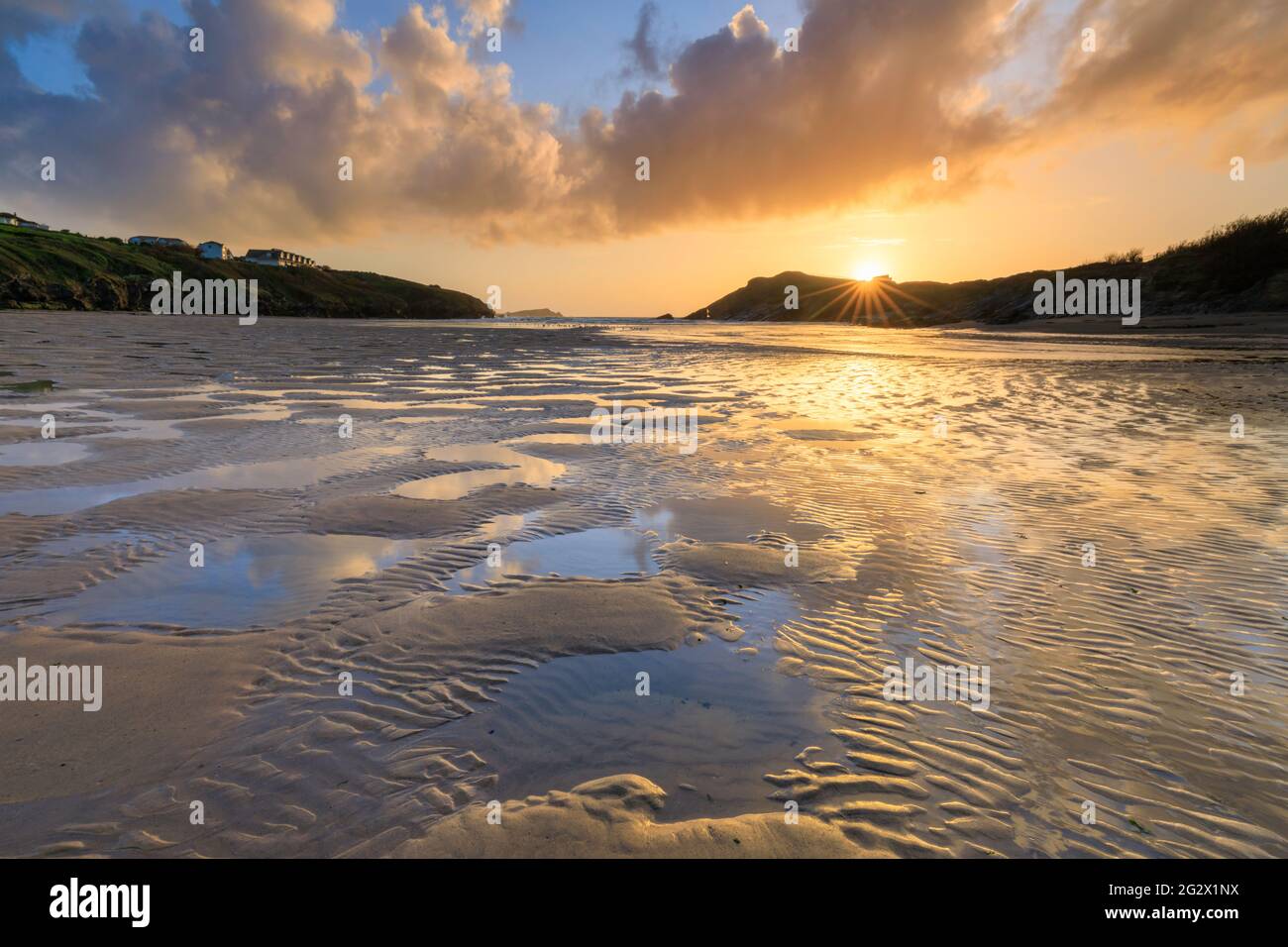 Sand patterns on Porth Beach in Cornwall with Towan Head at Newquay in the distance. Stock Photo