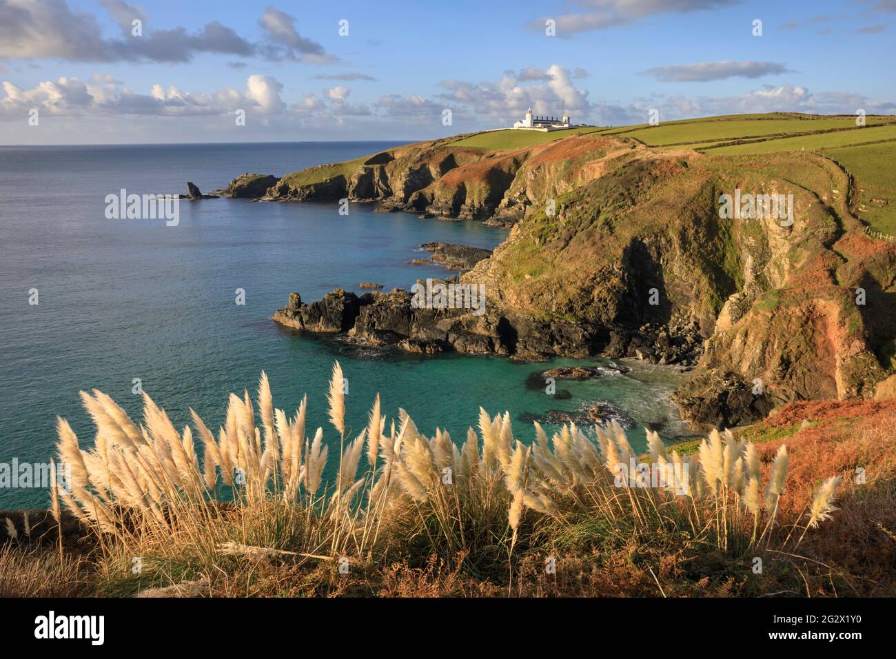 Lizard Lighthouse in Cornwall captured from the South West Coast Path above Housel Bay. Stock Photo