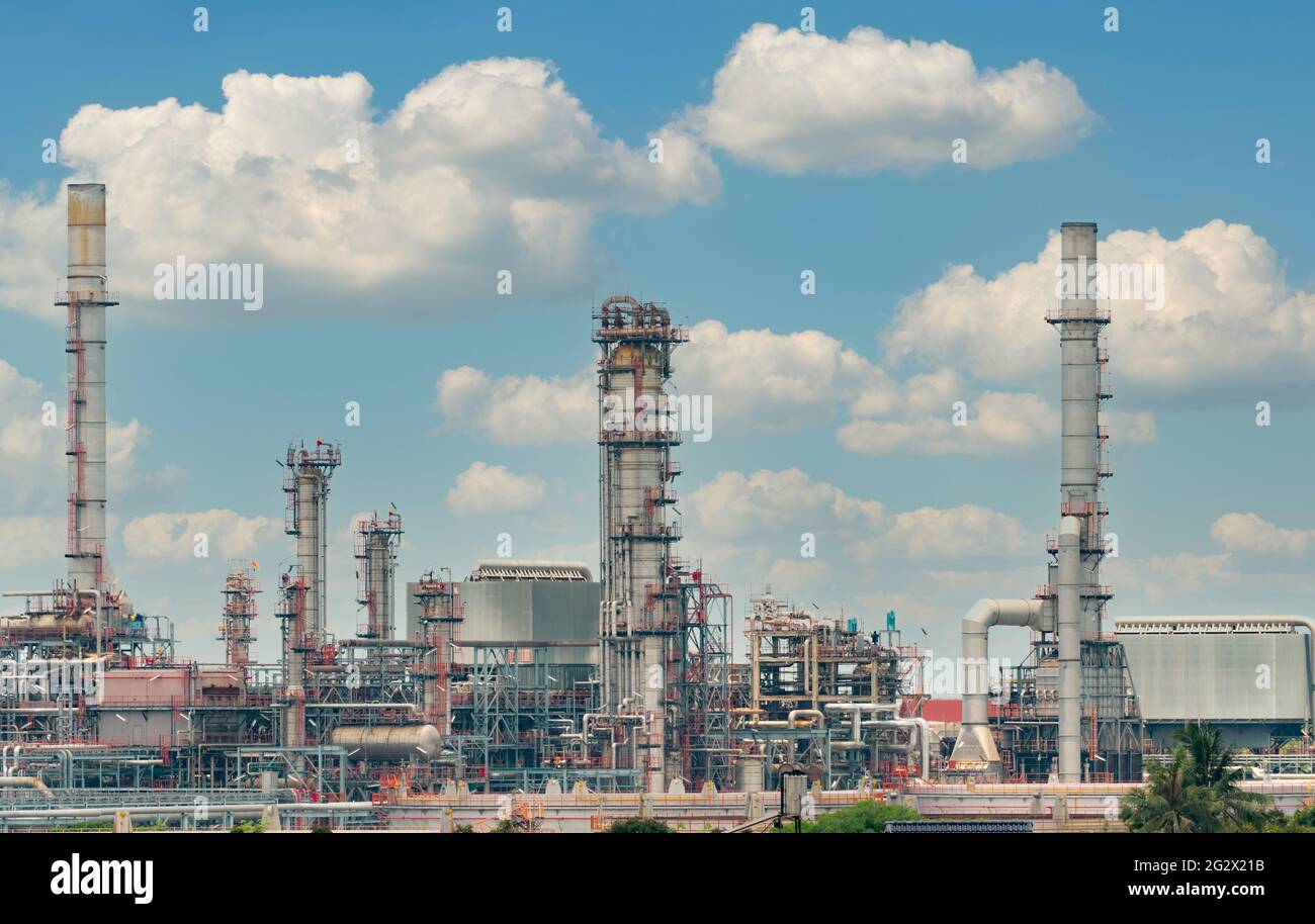 Oil refinery or petroleum refinery plant with blue sky background. Power and energy industry. Oil and gas production plant. Petrochemical industry. Stock Photo