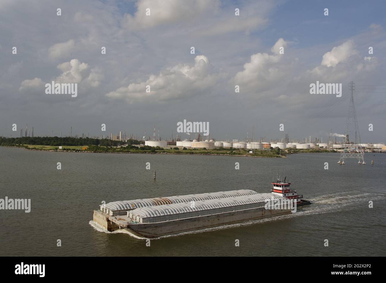 tug boat pushing 2 barges on Mississippi River, in the vicinity of New Orleans Stock Photo
