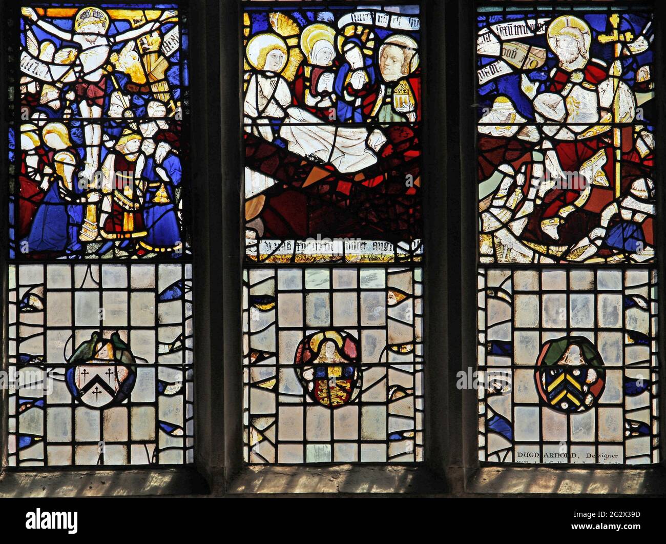 St Martin's Church, Stamford; 15th Century Stained Glass depicting, the Crucifixion, three Maries at the Tomb of Christ, and The Resurrection of Chris. Stock Photo