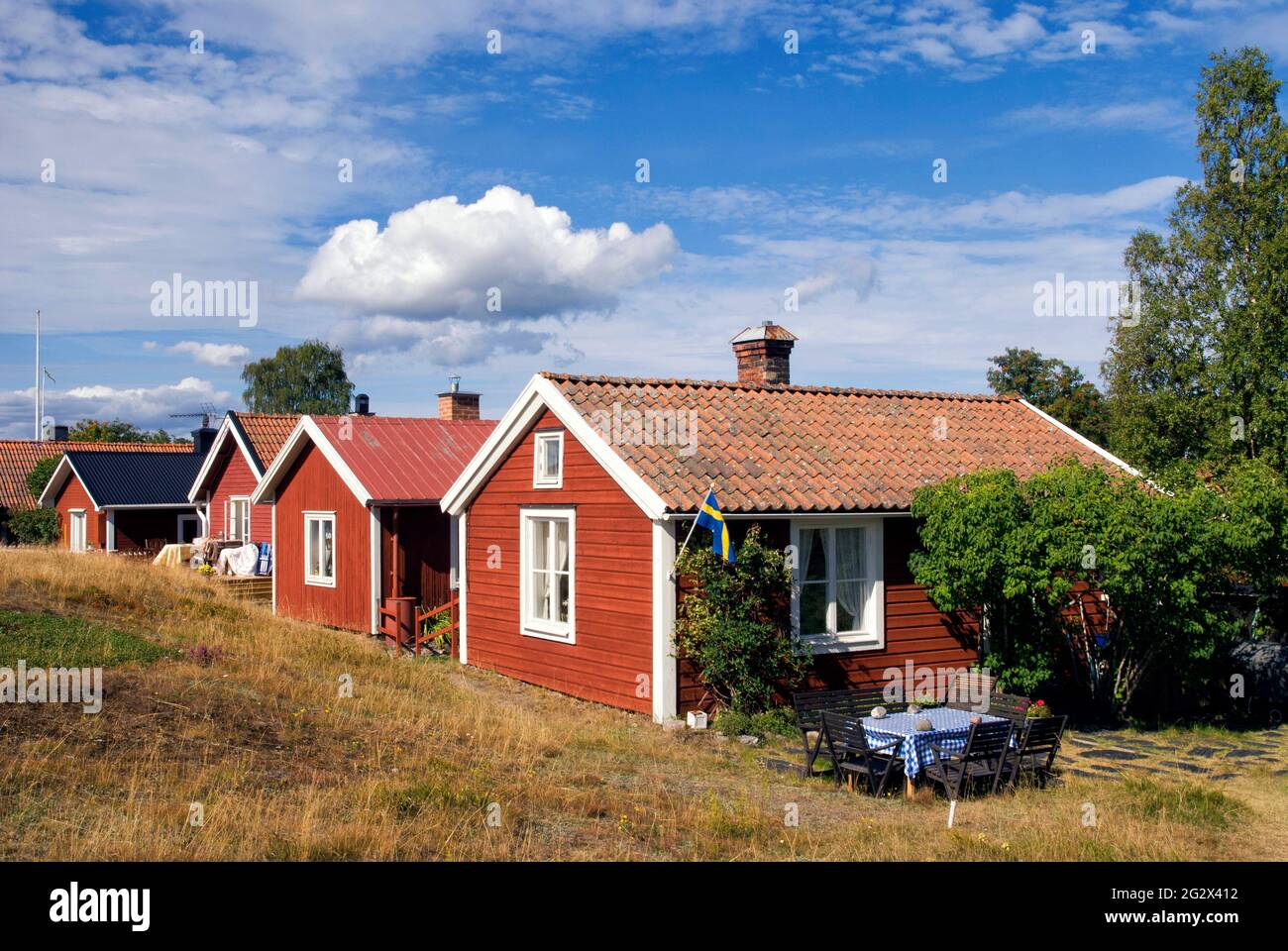 Traditional red painted houses in the Swedish village Holick Stock Photo