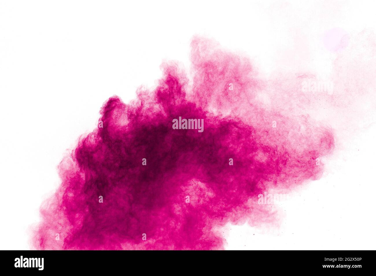 Explosion of pink colored powder isolated on white background.Pink dust splash. Stock Photo