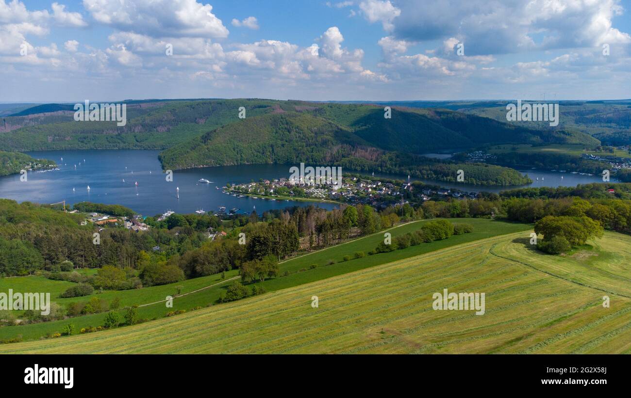Aerial view of the Rursee in the Eifel region, Germany with farmland in the foreground and district Woffelsbach Stock Photo