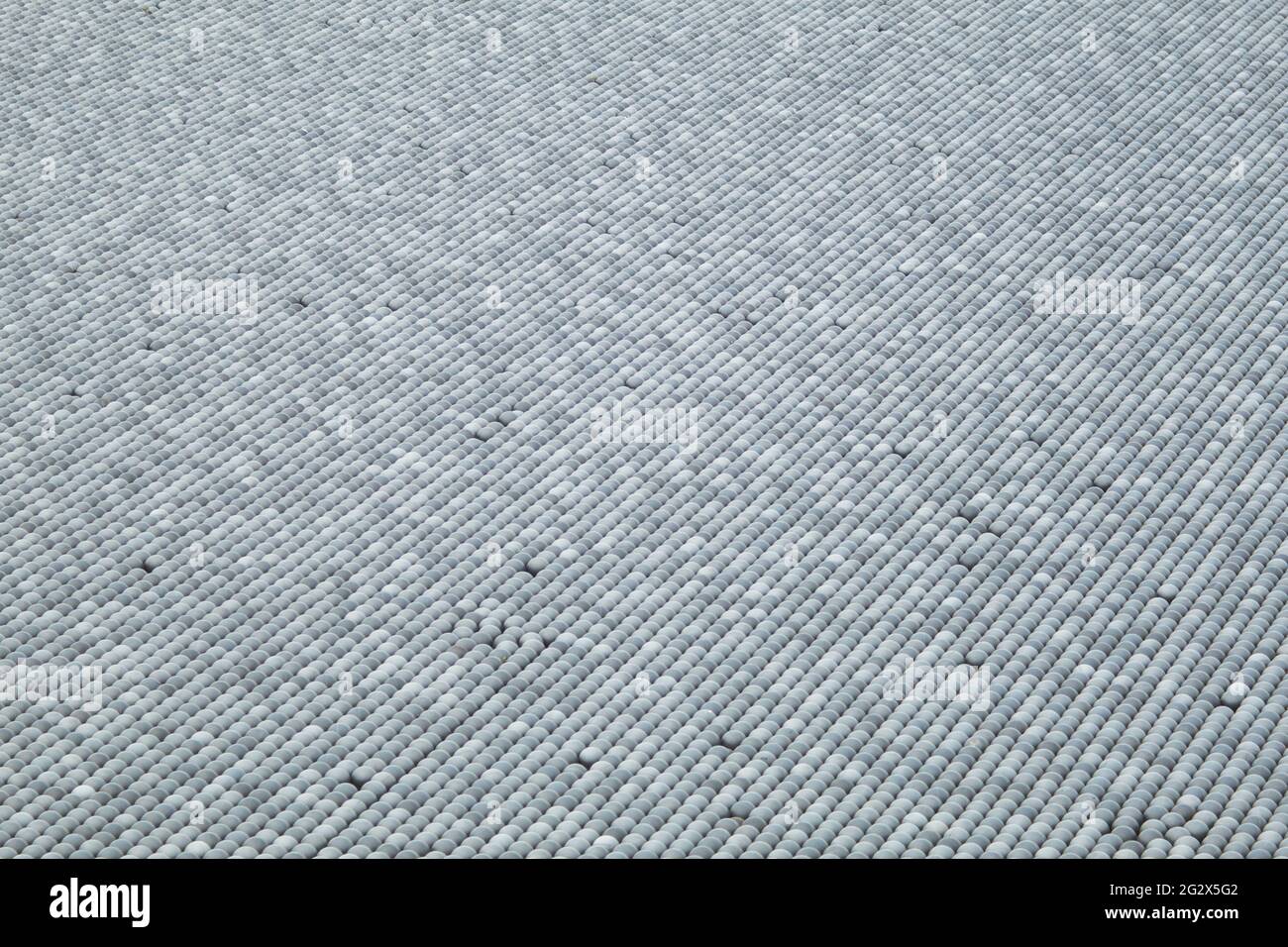 Black plastic balls for filling reservoirs. Shadow balls are small