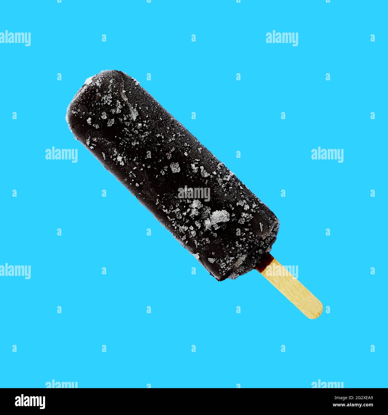 Chocolate ice cream lolly, chocolate glaze close-up with condensate and icing frost  isolated on blue background. Ice cream bar,summer hot day. Stock Photo