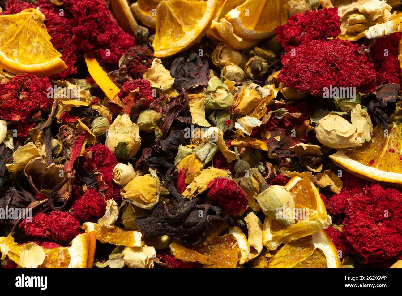 Texture of dry herbal tea with spices and fruits (hibiscus, orange