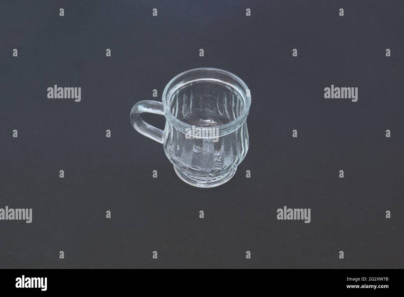 Glass cup in a dark background Stock Photo