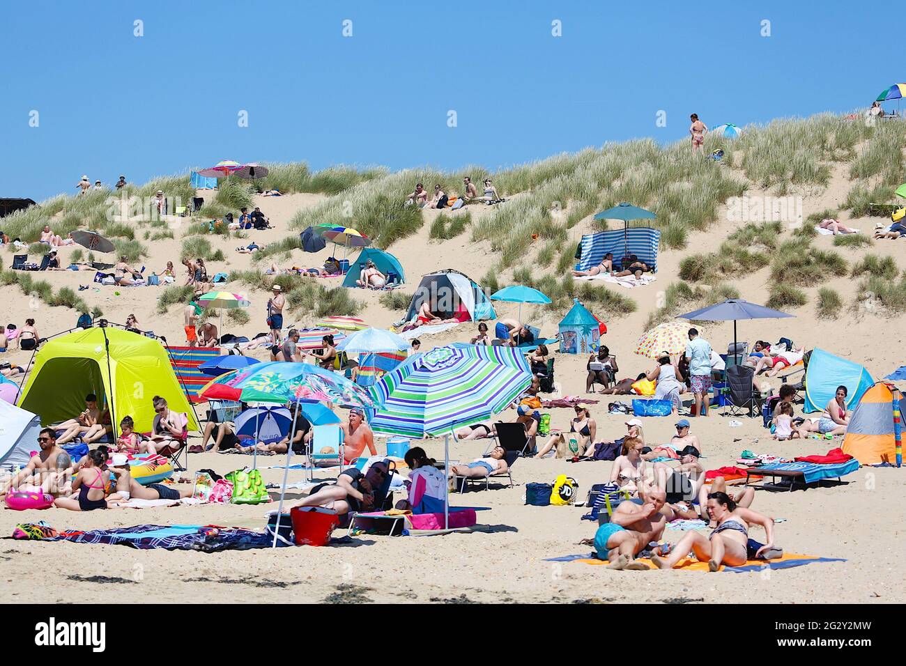 Camber, East Sussex, UK. 13 Jun, 2021. UK Weather: Large numbers of people are expected to make there way down to the golden sandy beaches of Camber in East Sussex this weekend as the weather gets hotter and hotter. England kick off their debut Euro 2020 match today as people make there way to the beach. Photo Credit: Paul Lawrenson /Alamy Live News Stock Photo