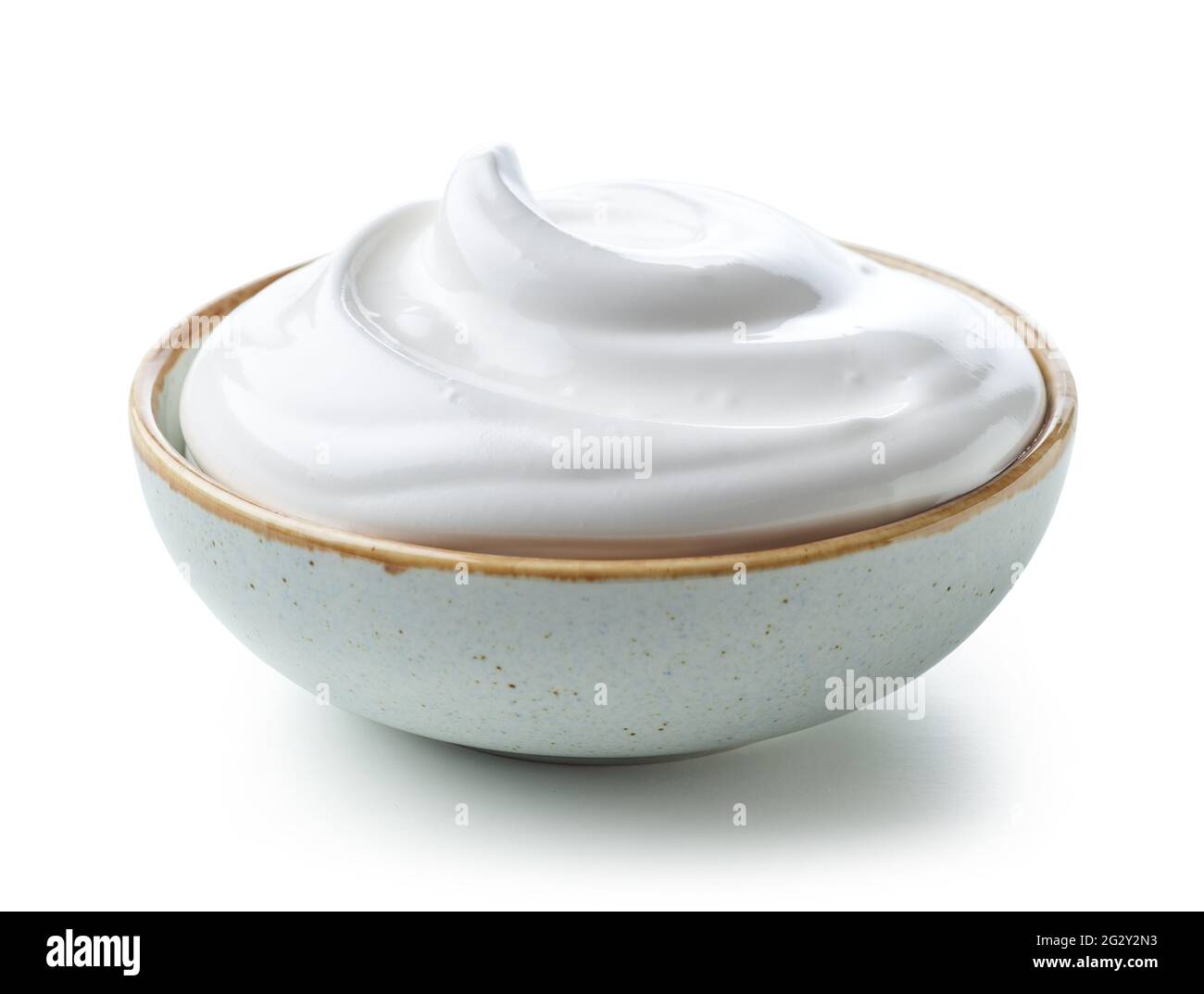 bowl of whipped egg whites cream isolated on white background Stock