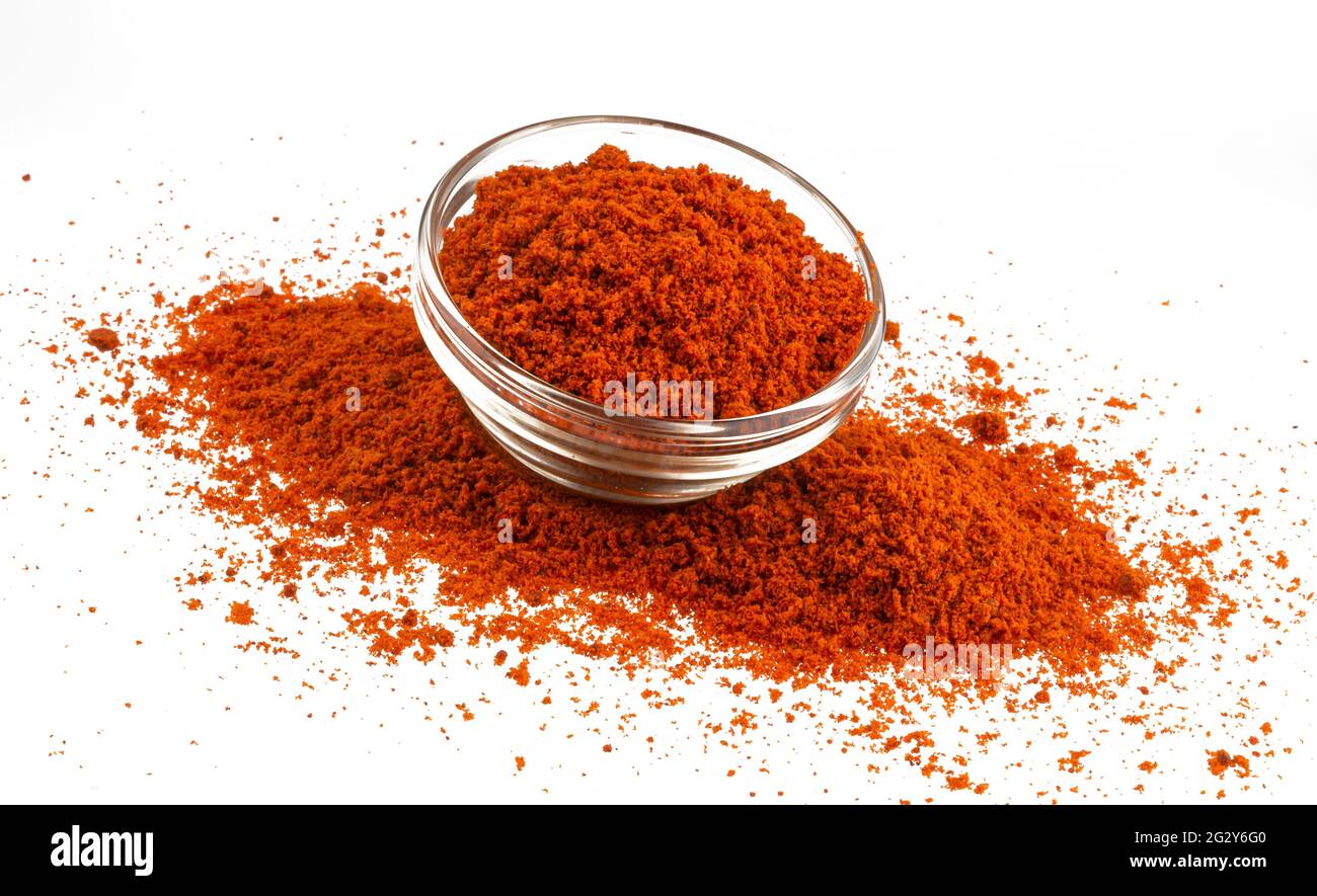 Premium Photo  Glass pepper pot with ground red paprika pepper isolated on  white background