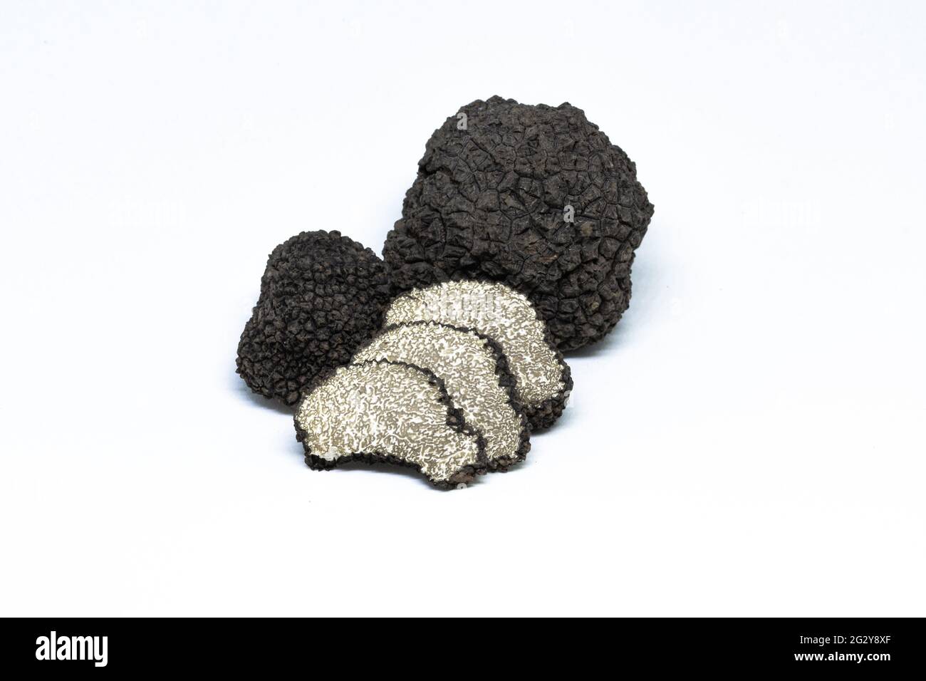 black-truffle-tuber-aestivum-cut-slice-open-photographed-on-a-white-background-2G2Y8XF.jpg
