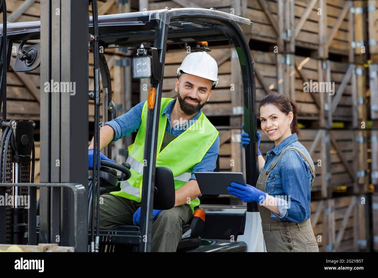 Warehouse workers, industry management with modern technology Stock Photo