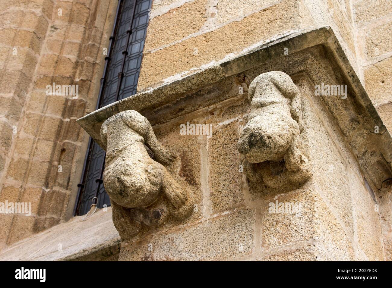 Caceres, Spain. Gargoyles in a palace in the Old Monumental Town, a World Heritage Site Stock Photo