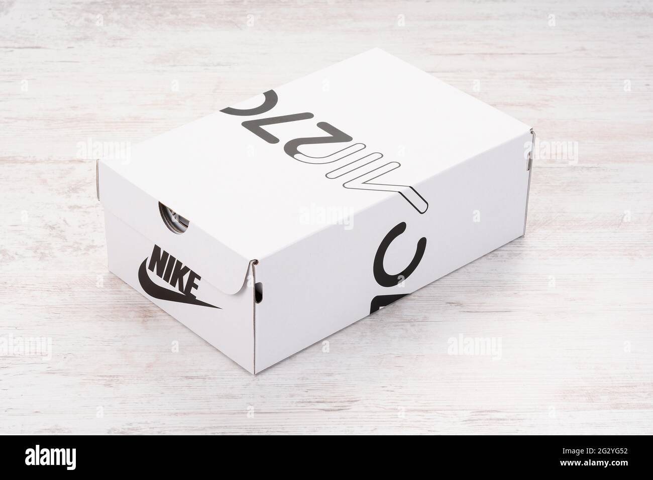 BURGAS, BULGARIA - DECEMBER 8, 2020: Nike Air MAX 270 REACT women's shoes - sneakers box white wooden background. Nike is a global sports clothes and Stock Photo